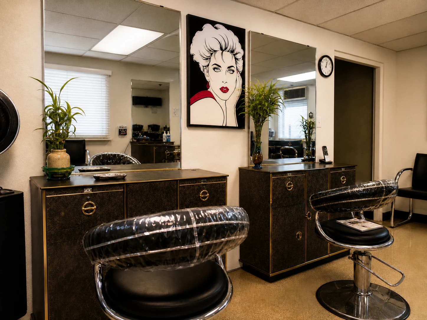 Inside Chino's One Stop Hair Salon with styling stations and pop-art wall detail